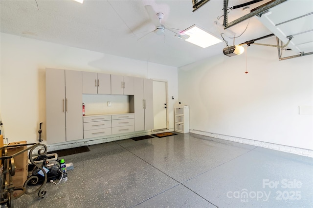 10418 Pullengreen Dr, Charlotte, NC 28277 - garage featuring a garage door opener and a ceiling fan