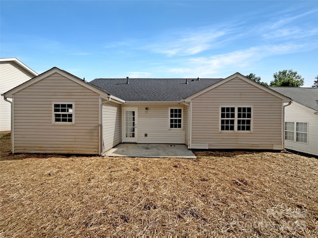 8219 Pozzi Rd, Charlotte, NC 28216 - rear view of house with a patio area and a shingled roof