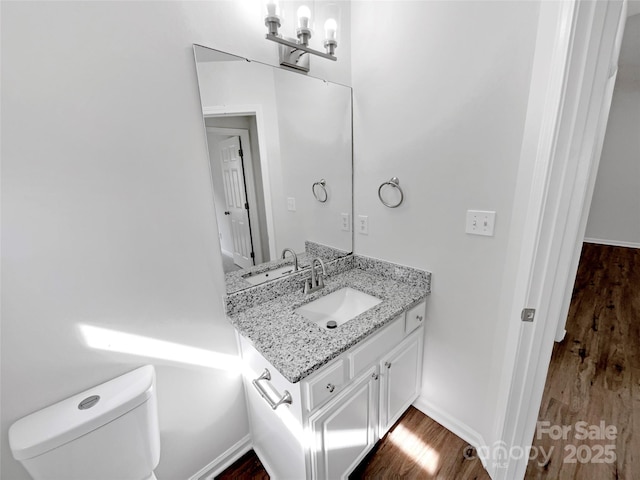 8219 Pozzi Rd, Charlotte, NC 28216 - bathroom with vanity and wood finished floors