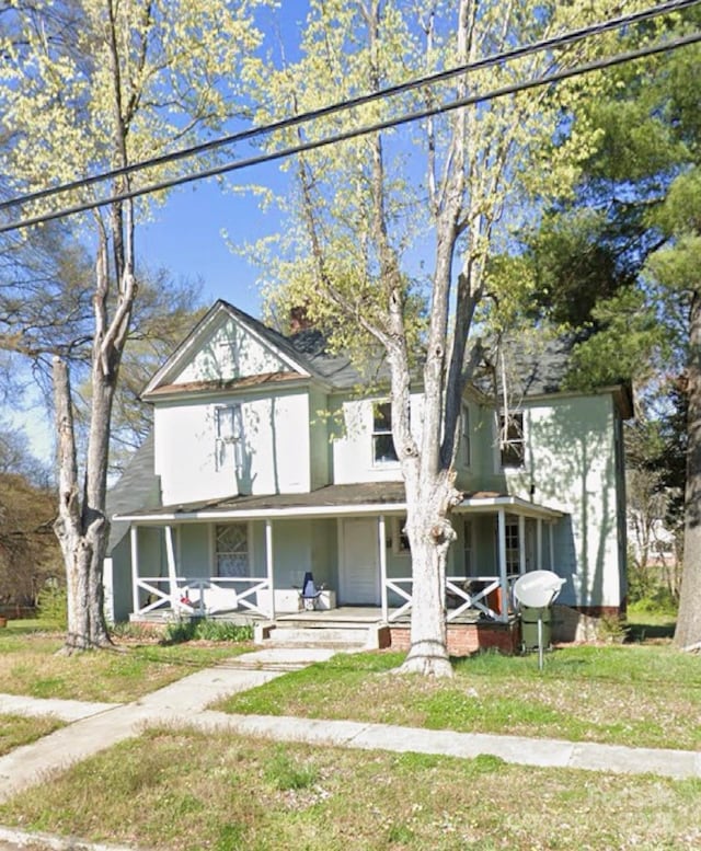 500 7th St, Spencer, NC 28159 - view of front of home featuring covered porch and a front yard