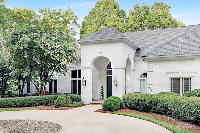 7912 Baltusrol Ln, Charlotte, NC 28210 - french provincial home with brick siding and a chimney