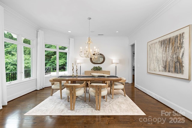 7912 Baltusrol Ln, Charlotte, NC 28210 - dining area with dark wood-style flooring, a chandelier, crown molding, and recessed lighting