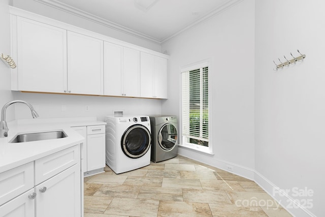 7912 Baltusrol Ln, Charlotte, NC 28210 - laundry area featuring cabinet space, washer and dryer, ornamental molding, and light stone finish floors