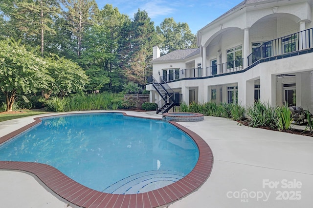 7912 Baltusrol Ln, Charlotte, NC 28210 - view of swimming pool with stairway, a pool with connected hot tub, and a patio area