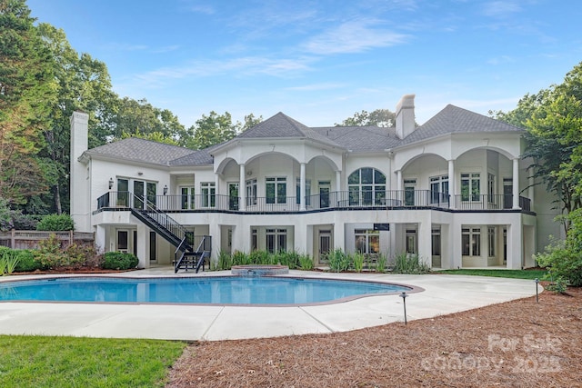 7912 Baltusrol Ln, Charlotte, NC 28210 - rear view of house featuring a chimney, stucco siding, and stairs