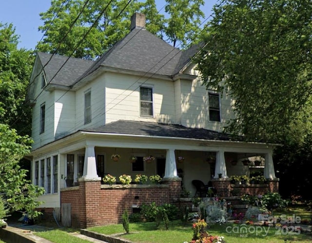 716 N Fulton St, Salisbury, NC 28144 - view of front of property featuring covered porch, a chimney, brick siding, and a shingled roof