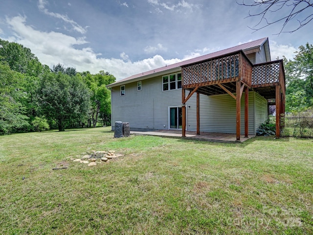 14 Spring Lake Dr, Fletcher, NC 28732 - rear view of property featuring a wooden deck, a lawn, and a metal roof