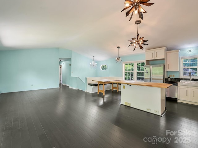 14 Spring Lake Dr, Fletcher, NC 28732 - kitchen with stainless steel appliances, wood counters, a chandelier, white cabinets, and dark wood-style floors