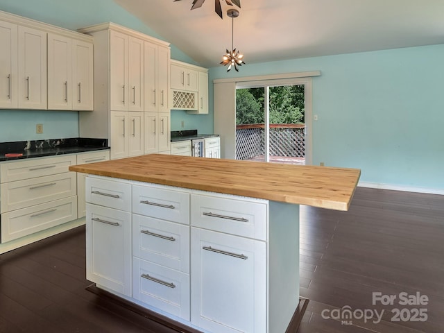 14 Spring Lake Dr, Fletcher, NC 28732 - kitchen featuring wooden counters, vaulted ceiling, dark wood finished floors, white cabinetry, and pendant lighting