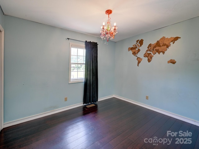 14 Spring Lake Dr, Fletcher, NC 28732 - spare room with a chandelier and dark wood finished floors