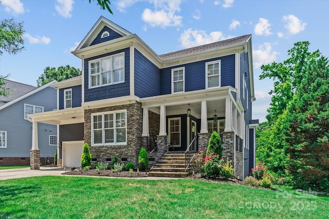 615 N Oak Dr, Huntersville, NC 28078 - view of front of home featuring stone siding, a porch, and a front lawn