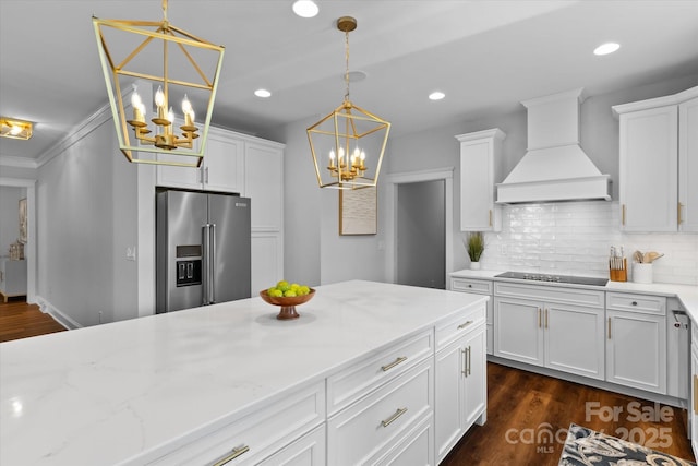 615 N Oak Dr, Huntersville, NC 28078 - kitchen featuring high end fridge, a chandelier, custom exhaust hood, white cabinets, and decorative backsplash