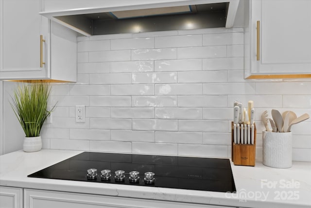 615 N Oak Dr, Huntersville, NC 28078 - kitchen view of extractor fan, white cabinets, and black electric stovetop