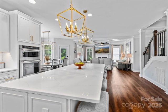 615 N Oak Dr, Huntersville, NC 28078 - kitchen with stainless steel double oven, a chandelier, recessed lighting, a kitchen island, and ceiling fan