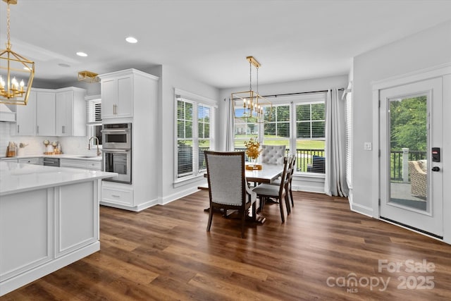 615 N Oak Dr, Huntersville, NC 28078 - dining space featuring a chandelier, plenty of natural light, recessed lighting, and dark wood finished floors