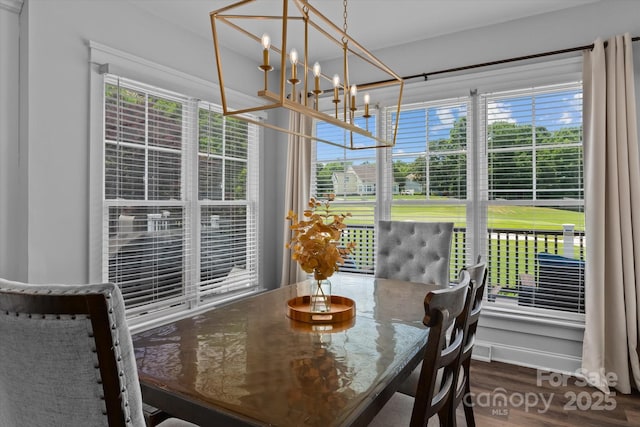 615 N Oak Dr, Huntersville, NC 28078 - dining space featuring a chandelier, healthy amount of natural light, and wood finished floors