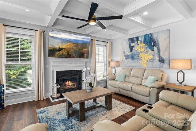 615 N Oak Dr, Huntersville, NC 28078 - living area with ceiling fan, wood finished floors, healthy amount of natural light, a glass covered fireplace, and beamed ceiling