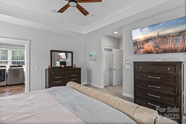 615 N Oak Dr, Huntersville, NC 28078 - bedroom with washer and clothes dryer, ornamental molding, recessed lighting, light carpet, and a tray ceiling