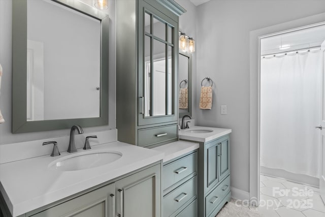 615 N Oak Dr, Huntersville, NC 28078 - full bath featuring two vanities and tile patterned flooring