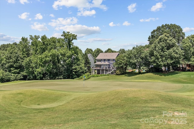 615 N Oak Dr, Huntersville, NC 28078 - view of community with golf course view, a lawn, a putting area, and view of wooded area