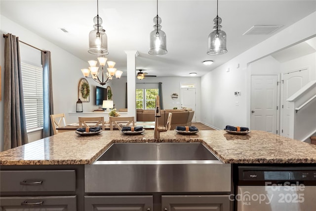 5069 Thomasville Dr, Belmont, NC 28012 - kitchen with dishwasher, open floor plan, ceiling fan, light stone countertops, and decorative light fixtures