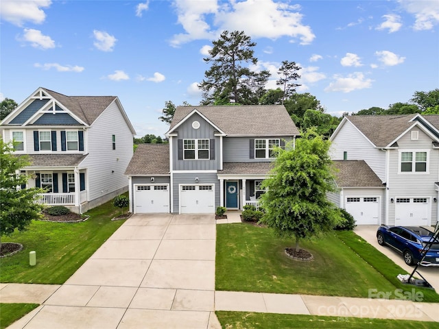 5069 Thomasville Dr, Belmont, NC 28012 - view of front of property featuring board and batten siding, driveway, a front lawn, and covered porch
