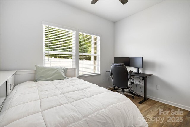 5069 Thomasville Dr, Belmont, NC 28012 - bedroom with wood finished floors, an office area, and a ceiling fan