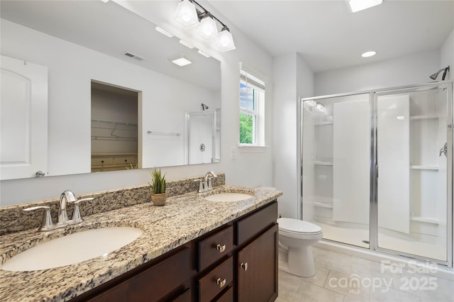 5069 Thomasville Dr, Belmont, NC 28012 - bathroom featuring a stall shower, double vanity, and tile patterned floors