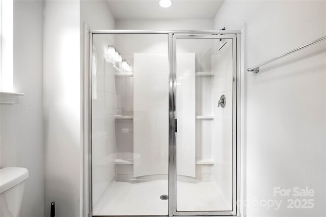 5069 Thomasville Dr, Belmont, NC 28012 - bathroom featuring toilet and a stall shower