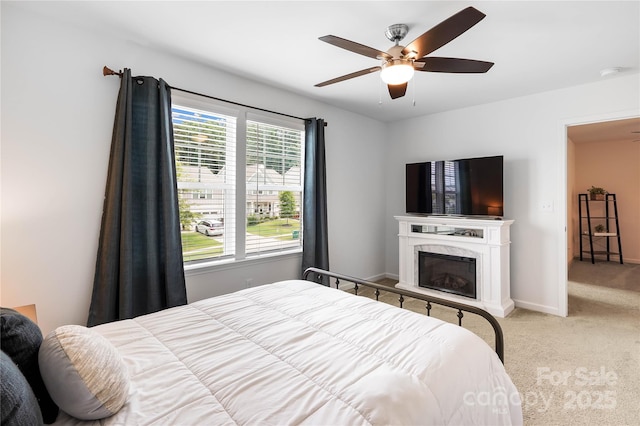 5069 Thomasville Dr, Belmont, NC 28012 - bedroom with carpet flooring, ceiling fan, and a high end fireplace