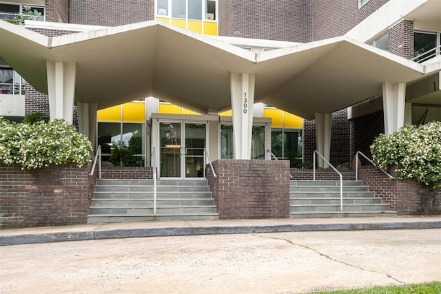 1300 Reece Rd Unit 206, Charlotte, NC 28209 - doorway to property featuring brick siding and a porch