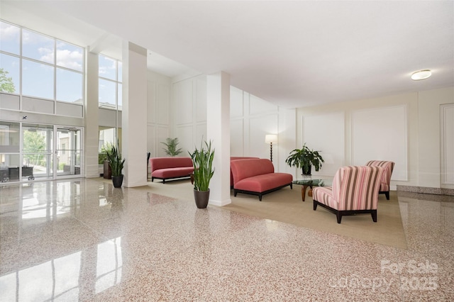 1300 Reece Rd Unit 206, Charlotte, NC 28209 - common area with a decorative wall and a towering ceiling
