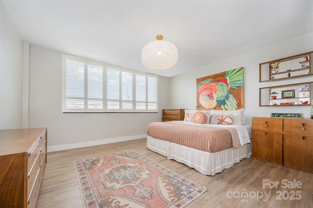 1300 Reece Rd Unit 206, Charlotte, NC 28209 - bedroom with light wood-type flooring and baseboards