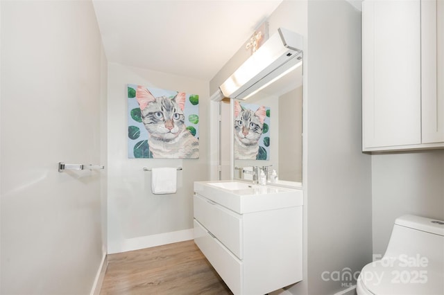 1300 Reece Rd Unit 206, Charlotte, NC 28209 - bathroom featuring vanity and wood finished floors
