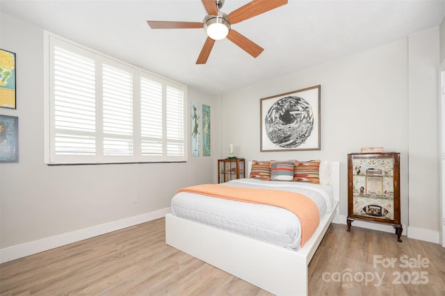 1300 Reece Rd Unit 206, Charlotte, NC 28209 - bedroom with wood finished floors and ceiling fan