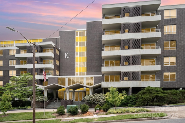 1300 Reece Rd Unit 206, Charlotte, NC 28209 - property at dusk with a view of apartment building / complex