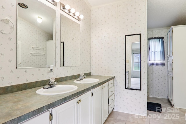 18 Sweet Briar Path Way, Hendersonville, NC 28792 - full bath featuring ornamental molding, wallpapered walls, double vanity, tile patterned floors, and lofted ceiling