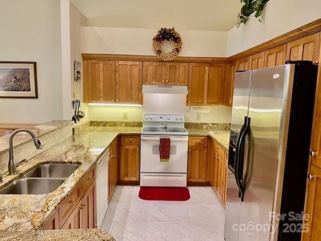 186 Stonecrest Ct, Lake Lure, NC 28746 - kitchen with white appliances, under cabinet range hood, and brown cabinets