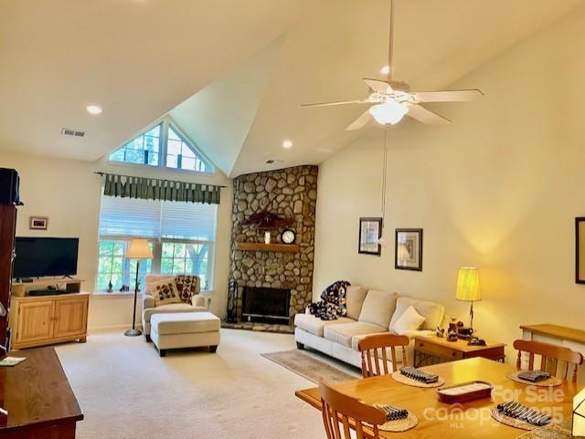 186 Stonecrest Ct, Lake Lure, NC 28746 - carpeted living area with healthy amount of natural light, high vaulted ceiling, ceiling fan, a fireplace, and recessed lighting