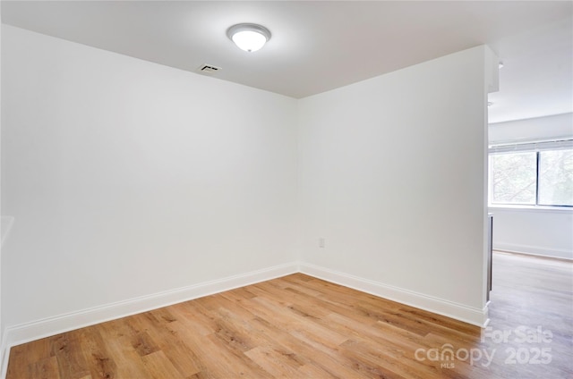 4806 Spring Lake Dr Unit D, Charlotte, NC 28212 - unfurnished room featuring light wood-style floors and baseboards
