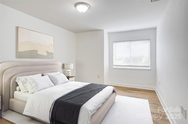 4806 Spring Lake Dr Unit D, Charlotte, NC 28212 - bedroom featuring light wood-style floors and baseboards