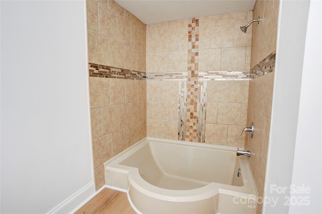 4806 Spring Lake Dr Unit D, Charlotte, NC 28212 - bathroom with shower / tub combination and wood finished floors