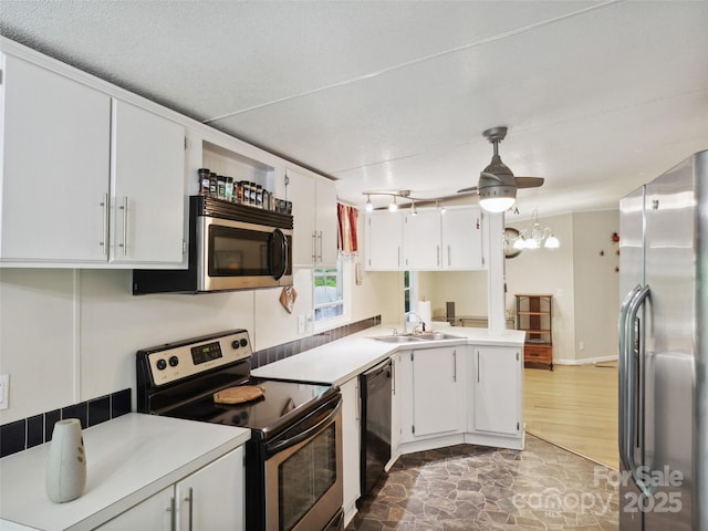 275 Bulldog Ln, Green Mountain, NC 28740 - kitchen featuring stainless steel appliances, white cabinets, light countertops, and a peninsula