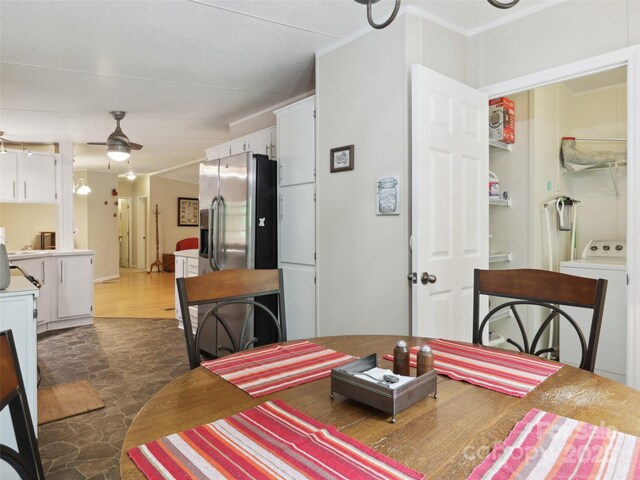 275 Bulldog Ln, Green Mountain, NC 28740 - dining space featuring washer / clothes dryer, stone finish floors, a ceiling fan, and crown molding
