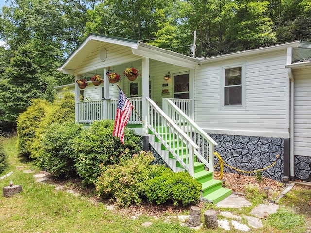 275 Bulldog Ln, Green Mountain, NC 28740 - view of front of home featuring covered porch