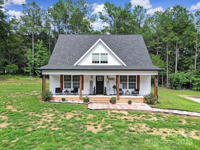 4592 Reid Rd, Edgemoor, SC 29712 - modern inspired farmhouse with a porch, a front lawn, and a shingled roof