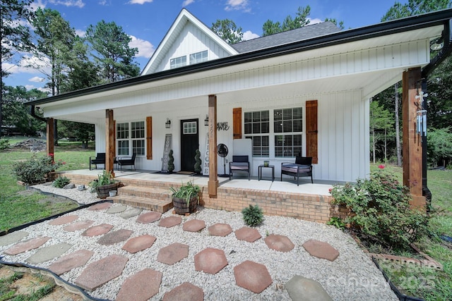 4592 Reid Rd, Edgemoor, SC 29712 - view of front of house with a porch and board and batten siding