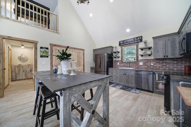 4592 Reid Rd, Edgemoor, SC 29712 - dining room with light wood-type flooring, high vaulted ceiling, and recessed lighting