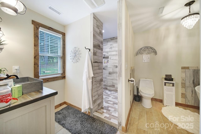 4592 Reid Rd, Edgemoor, SC 29712 - bathroom with a walk in shower, wood finished floors, and vanity