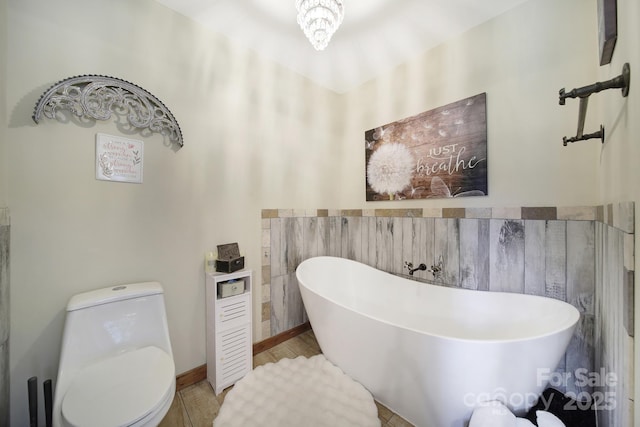 4592 Reid Rd, Edgemoor, SC 29712 - bathroom featuring a freestanding bath and tile walls